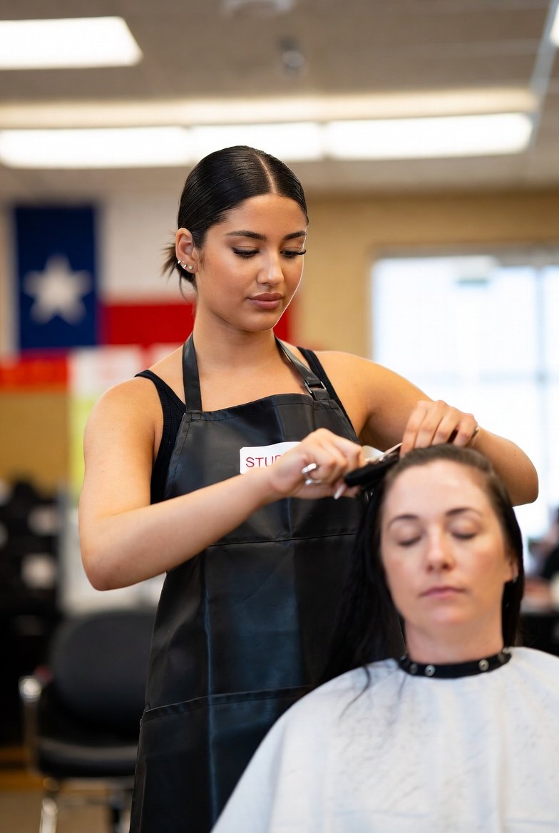 Confident cosmetology student wearing a black apron