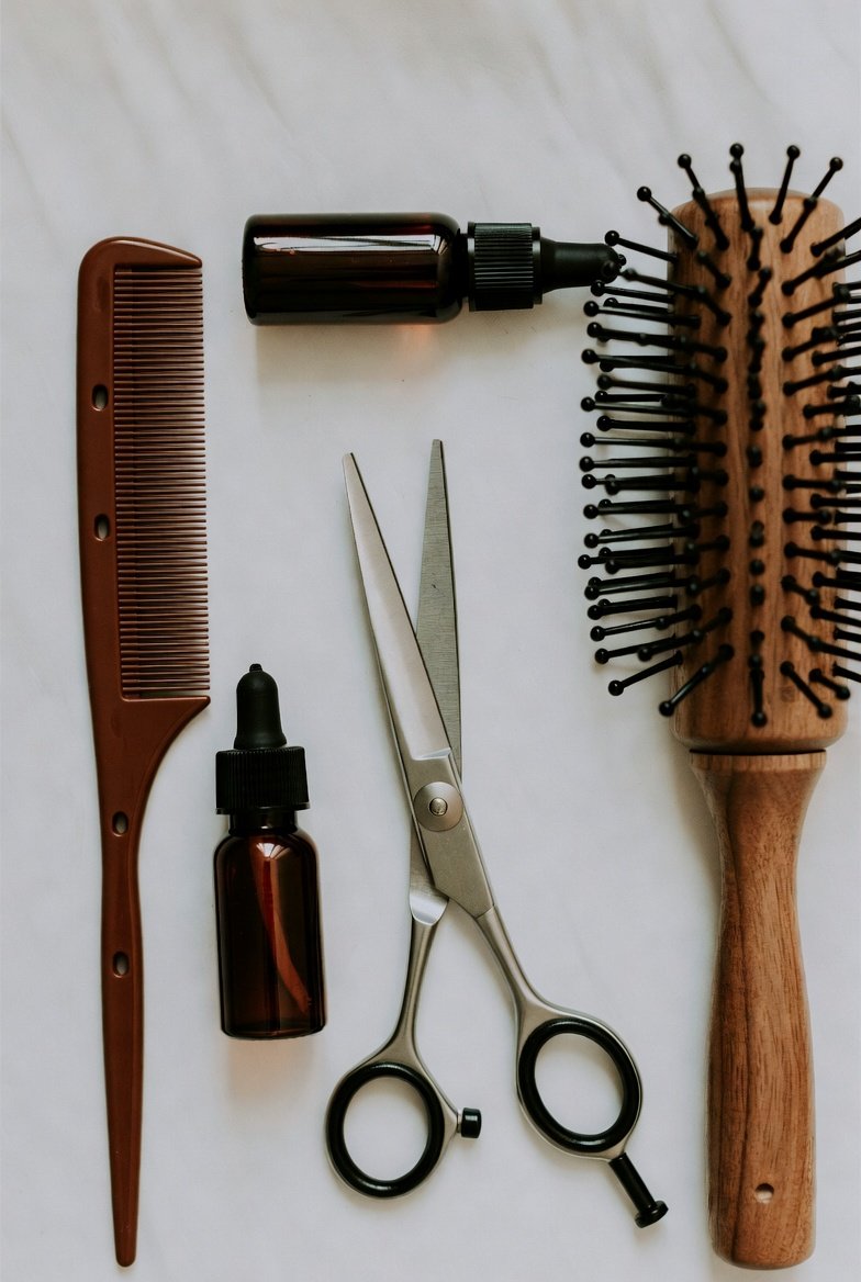 Professional cosmetology tools arranged on surface