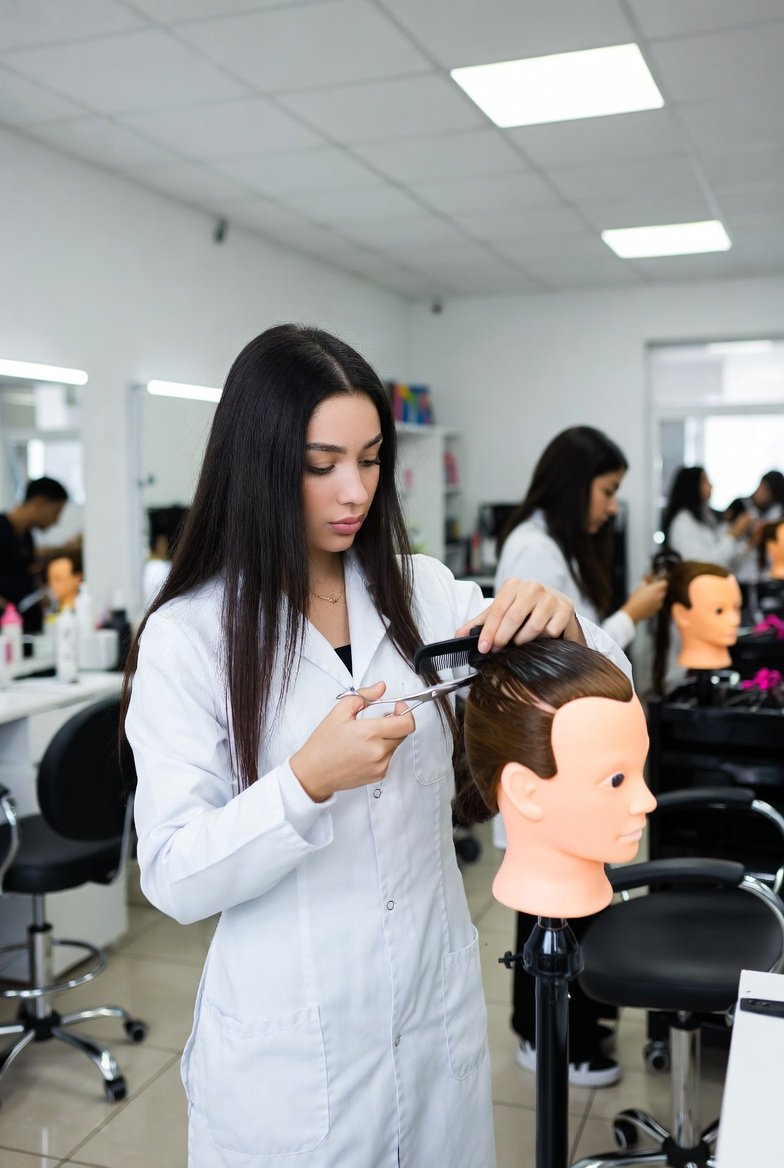 A Texas cosmetology student practicing hair styling on a mannequin head